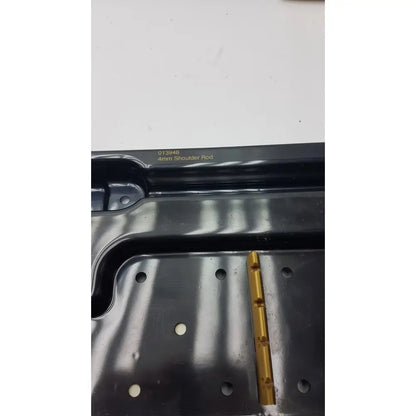 Black plastic nephew endoscopy portal accessory with a gold metal 4mm shoulder rod labeled 013948 in smith & nephew system