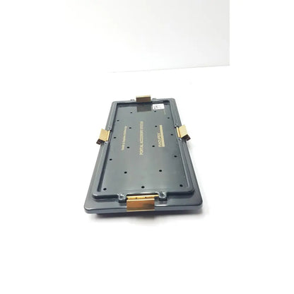 Black plastic smith & nephew endoscopy portal accessory stash with gold-tone metal clasps and hinges