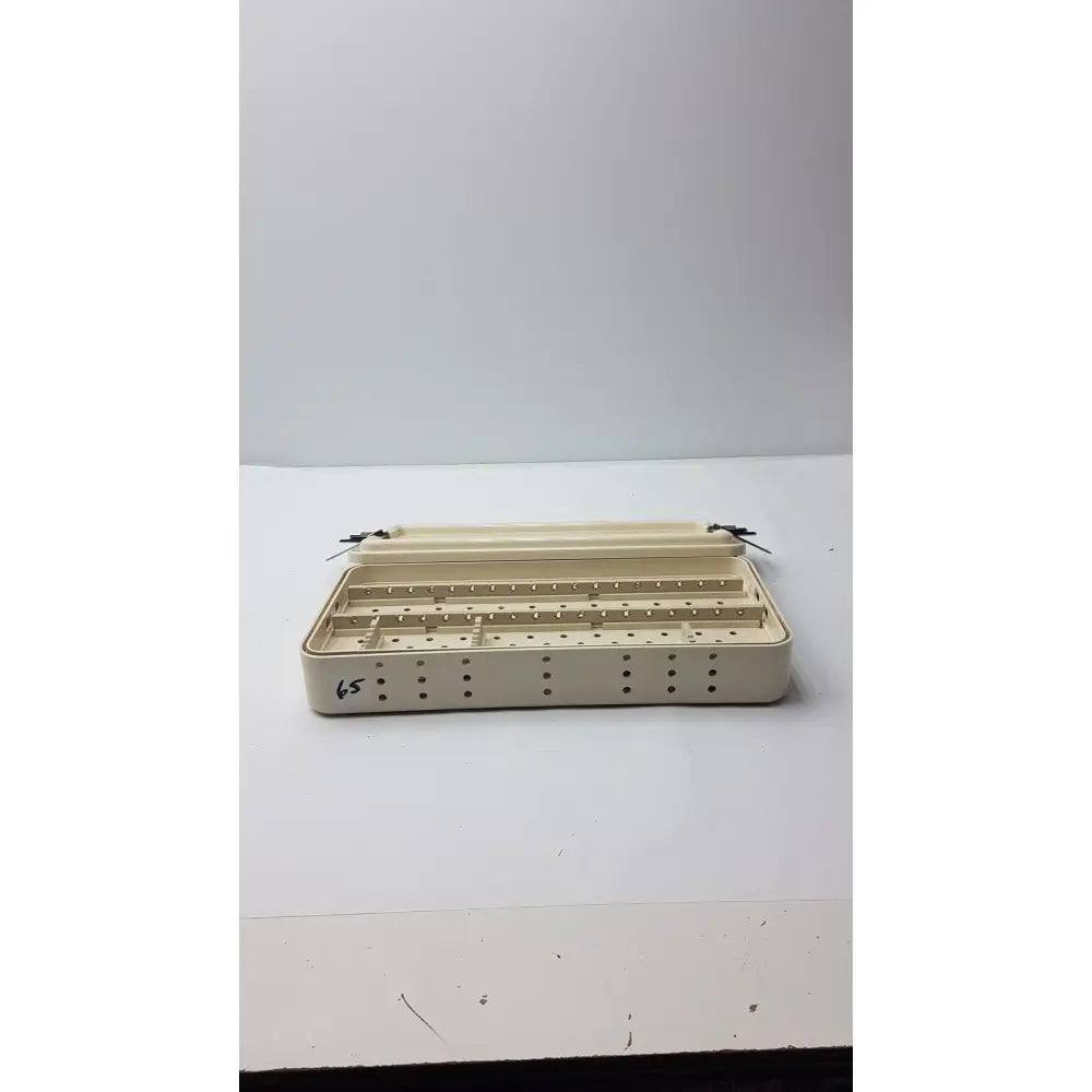 Beige plastic nephew ref 7207934 hip arthroscopy empty tray with multiple compartments and perforated sides