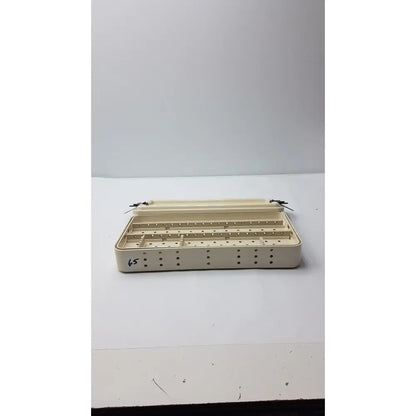 Beige plastic nephew ref 7207934 hip arthroscopy empty tray with multiple compartments and perforated sides