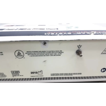 White rectangular back panel of the nephew truclear hysteroscopic morcellator console with regulatory labels and power switch