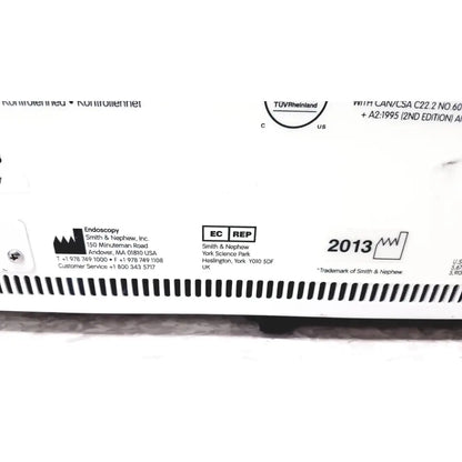 White plastic device label with black text and smith and nephew branding on nephew truclear hysteroscopic morcellator console