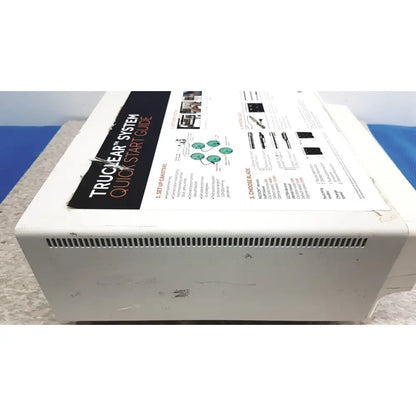 White plastic smith & nephew truclear hysteroscopic morcellator console box with black and white instruction manual attached