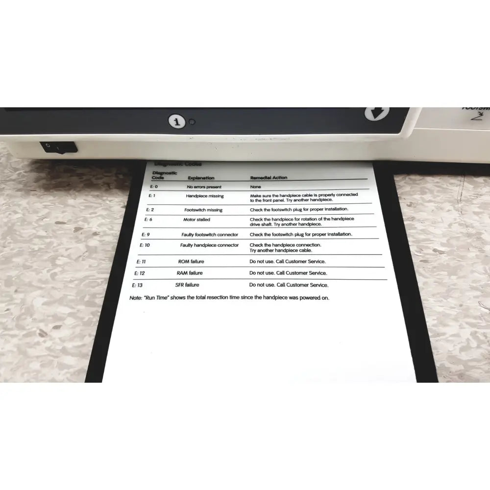 Black-framed diagnostic printout showing error codes for smith & nephew truclear hysteroscopic morcellator console