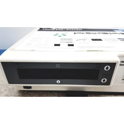 White medical device with black control panel and circular button labeled trueear system nephew truclear hysteroscopic morcellator console