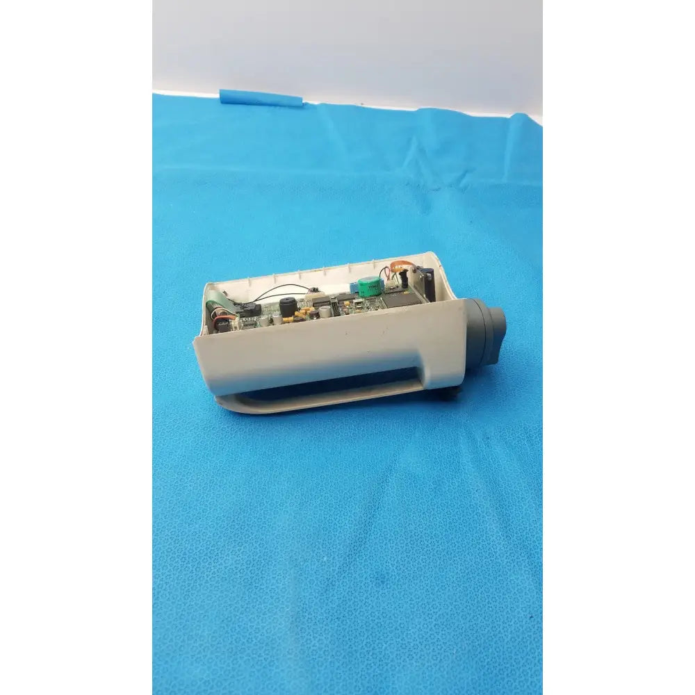 Gray plastic housing of smiths medfusion 3010a with exposed internal circuit board and rotating pole clamp attachment