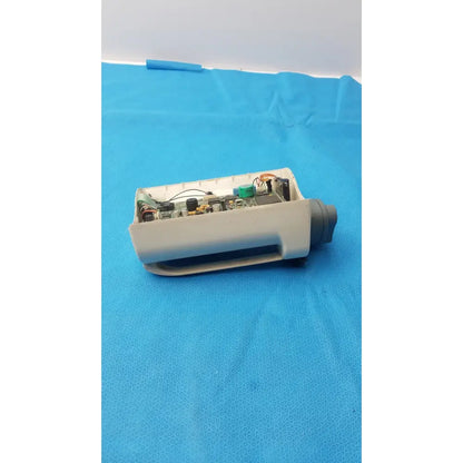 Gray plastic housing of smiths medfusion 3010a with exposed internal circuit board and rotating pole clamp attachment