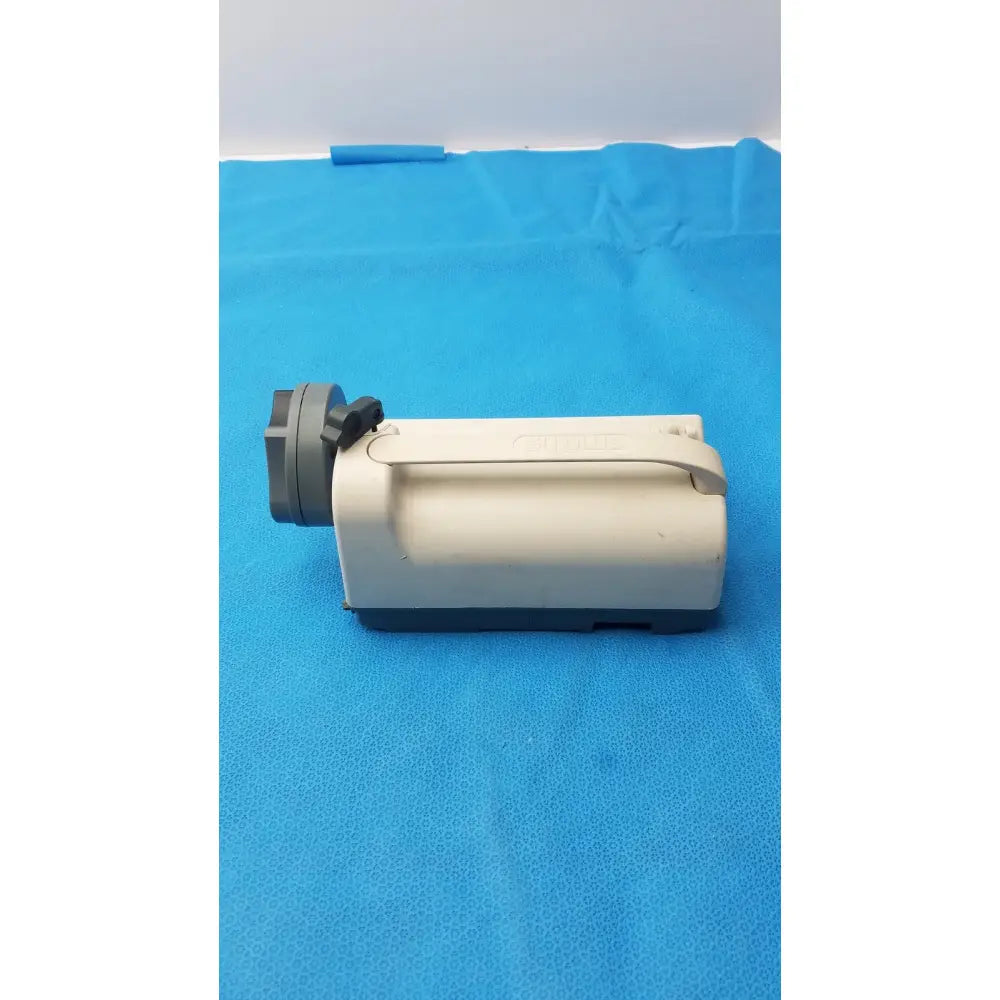 Beige and gray plastic handheld video camera with handle grip featured with smiths medfusion 3500 rotating pole clamp
