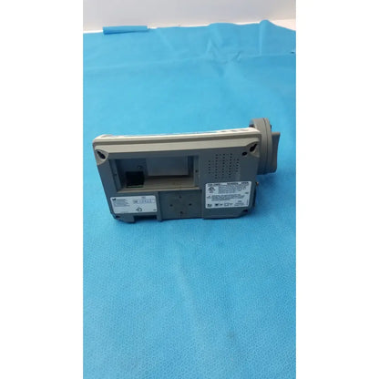 Gray smiths medfusion 3500 medical device with rectangular body, perforated ventilation, and rotating pole clamp side view