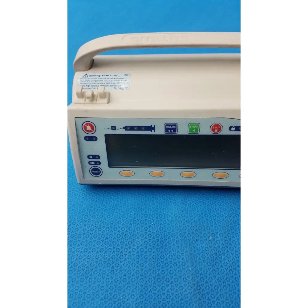 Beige smiths medfusion 3500 medical infusion pump with digital display and rotating pole clamp control buttons