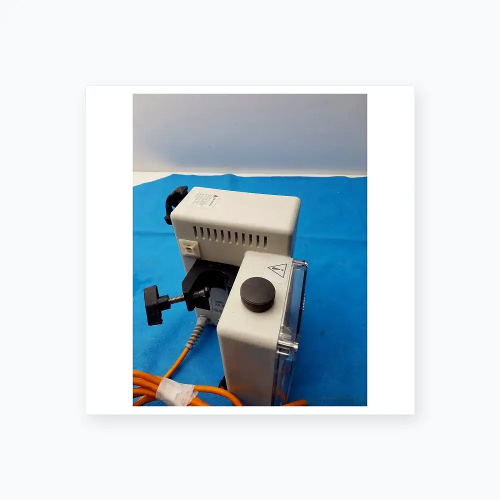 White plastic smiths medical fluid warmer control box unit with black clamp and orange cables for medical equipment use