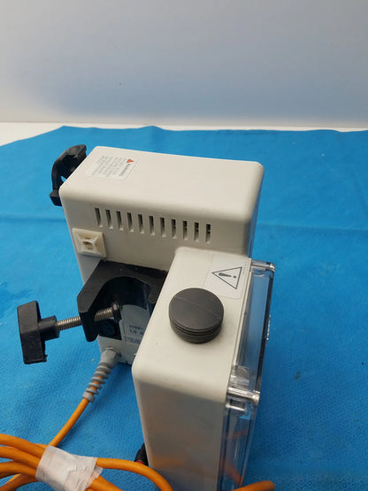 White plastic smiths medical fluid warmer control box unit with black clamp and orange cables for medical equipment use