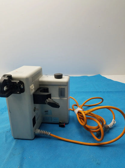 Gray metallic smiths medical fluid warmer control box unit with black components and coiled orange power cord for medical equipment