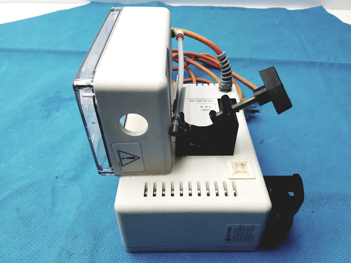 White plastic dental handpiece with transparent cover and black knob in smiths medical HL-390 fluid warmer medical equipment