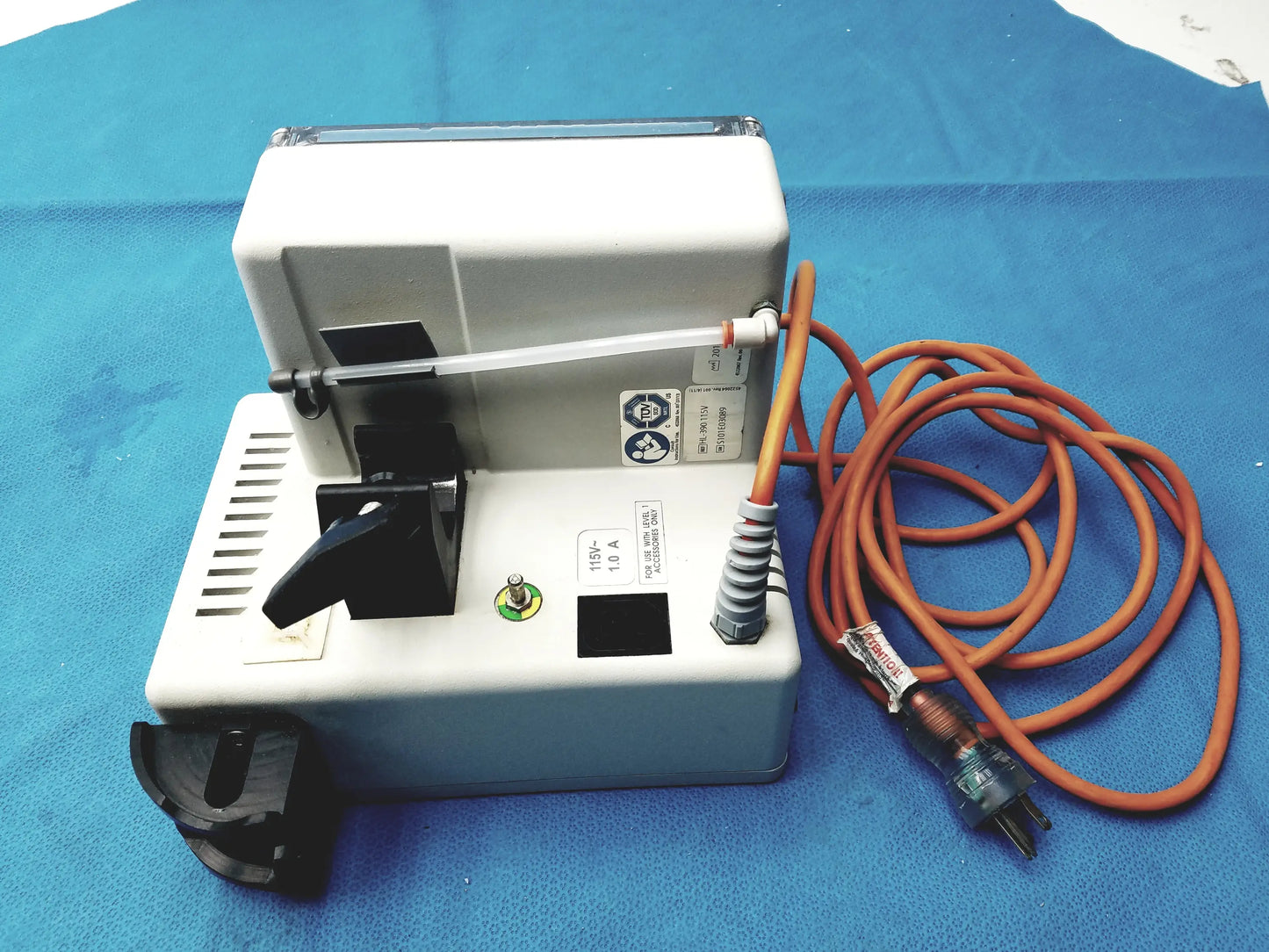 White plastic dental handpiece with black components and orange power cord for smiths medical hl-390 fluid warmer medical equipment