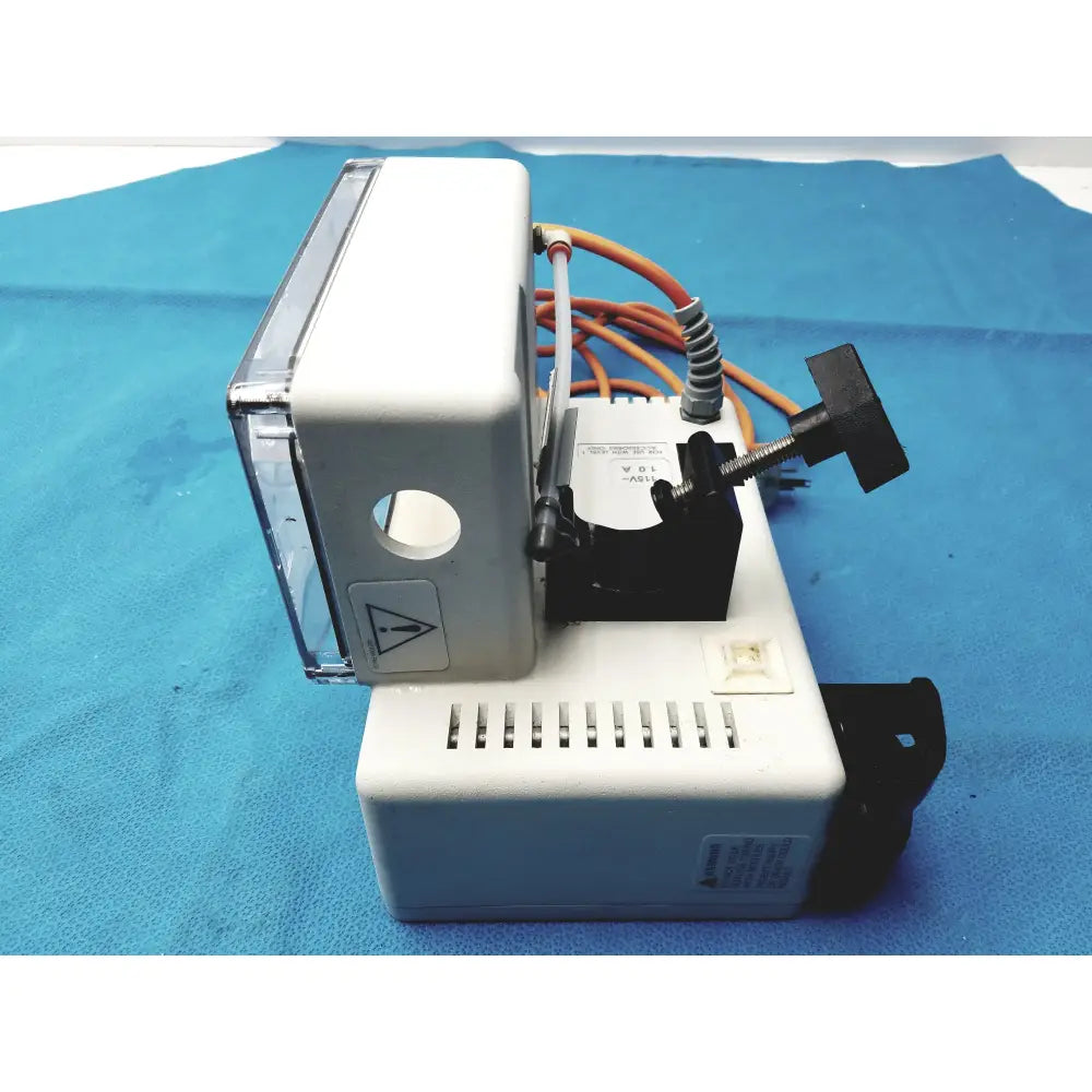 White plastic dental handpiece with transparent cover and black knob in smiths medical HL-390 fluid warmer medical equipment