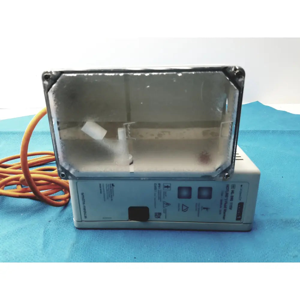 Gray rectangular smiths medical hl-390 level 1 hotline 3 fluid warmer with clear glass front panel and orange power cord medical equipment