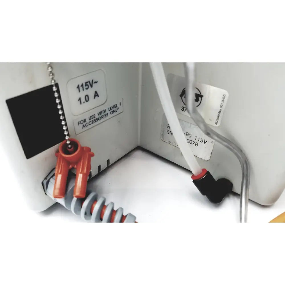White plastic electrical outlet with orange and black connectors and silver chain pull switch for smiths medical hotline fluid level 1 fluid warmer