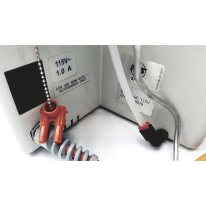 White plastic electrical outlet with orange and black connectors and silver chain pull switch for smiths medical hotline fluid level 1 fluid warmer