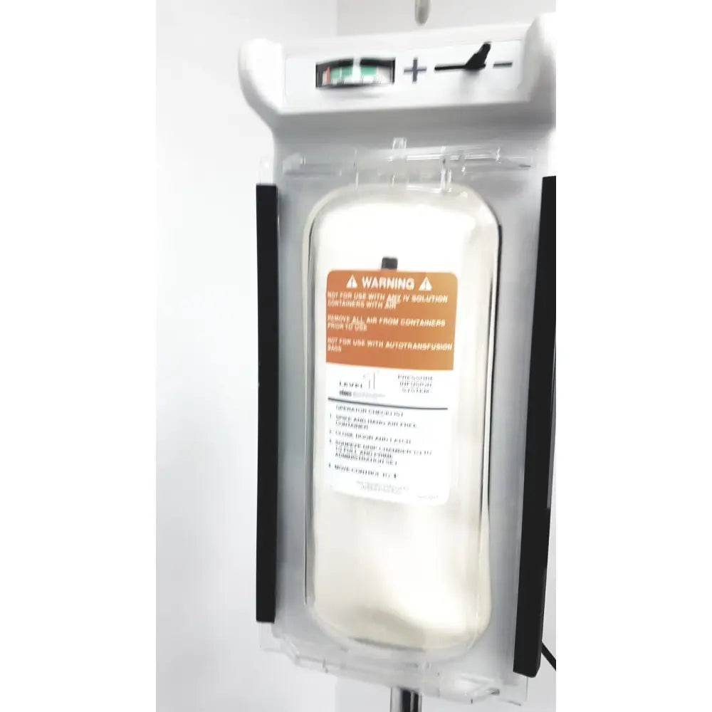 Clear plastic iv bag with orange warning label in a white smiths medical level 1 fluid warming system infusion pump