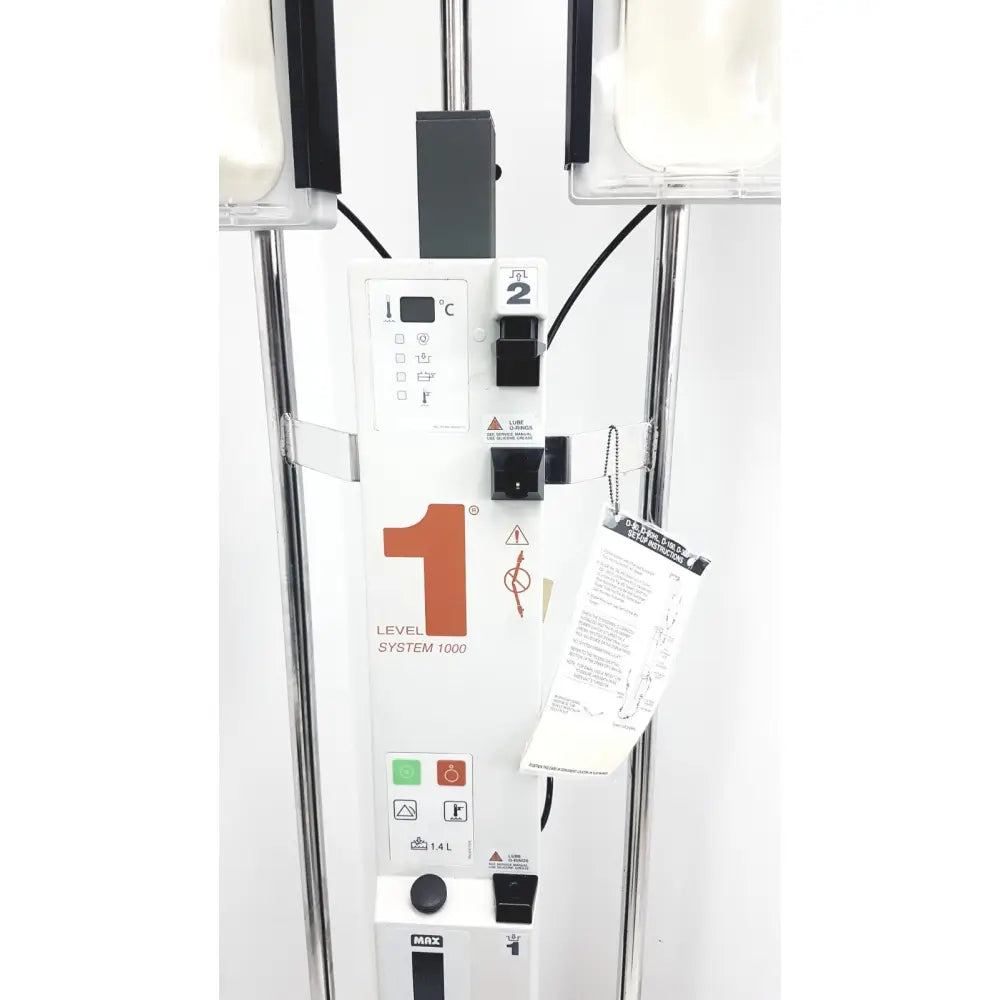 White medical iv infusion pump with orange 1 logo and black buttons from smiths medical level fluid warming system