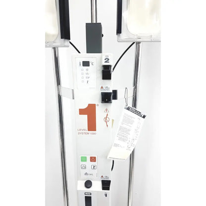 White medical iv infusion pump with orange 1 logo and black buttons from smiths medical level fluid warming system
