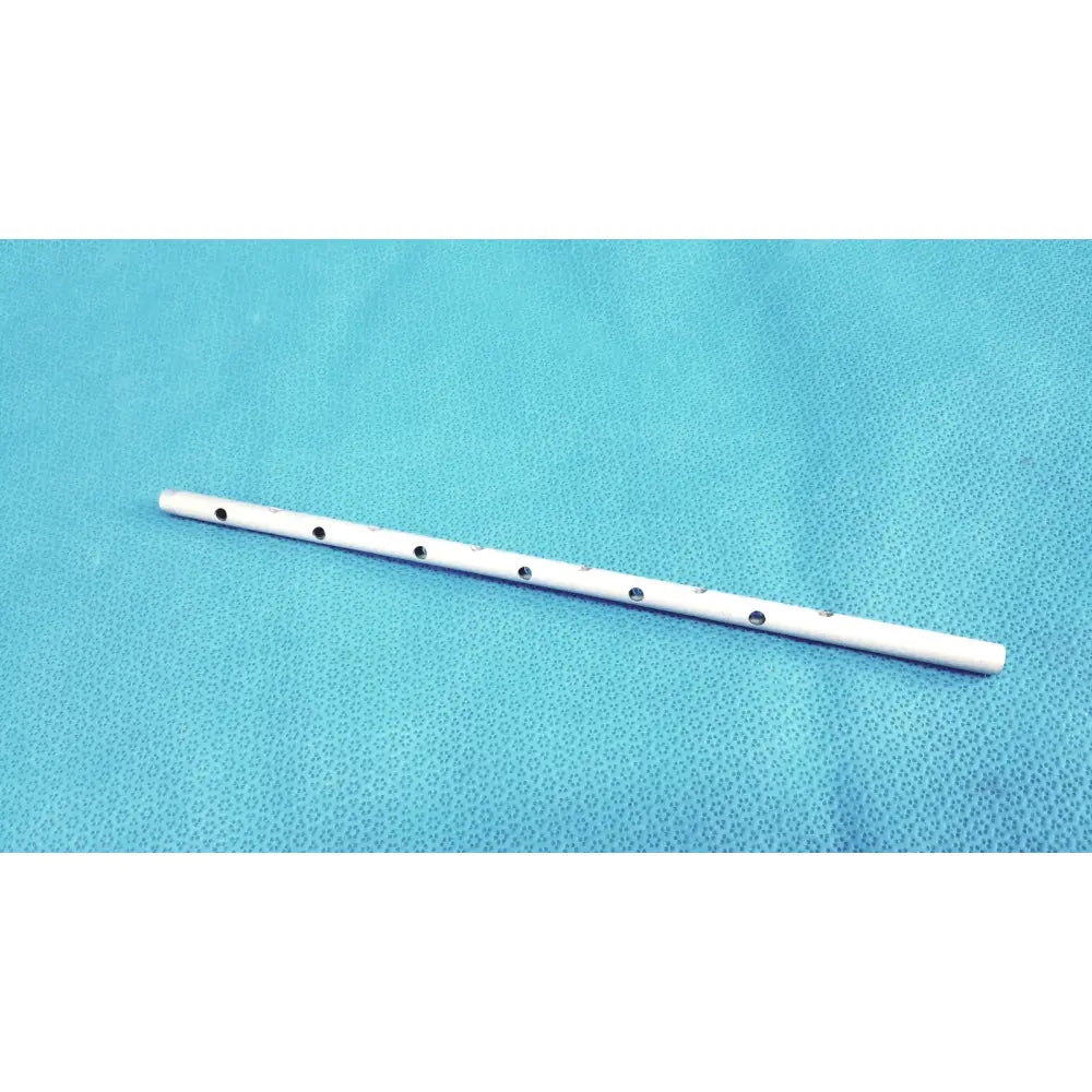 White plastic flute with seven black circular finger holes shown with snowden pencer pretzel articulating retractor product