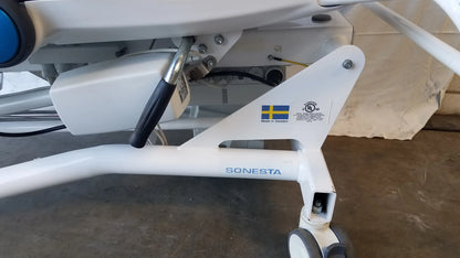 White metal sonesta s3 ultimate patient positioning procedure chair frame with swedish flag sticker for patient positioning
