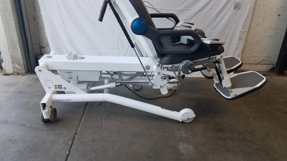White motorized recliner Sonesta S3 ultimate patient positioning procedure chair with black seat, footrests, and blue control knob