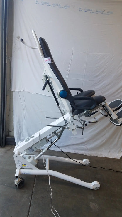 White and black adjustable Sonesta S3 ultimate patient positioning procedure chair with padded seat and wheeled base
