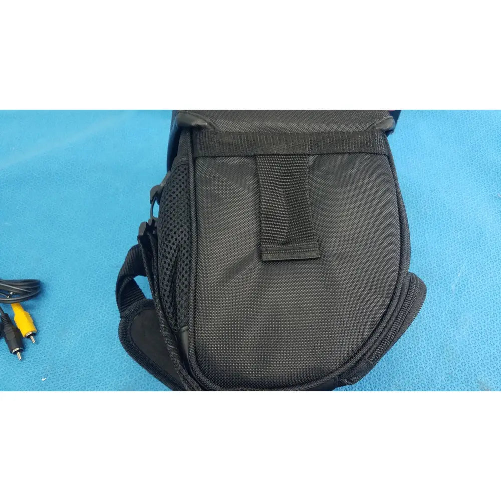 Black mesh and nylon camera bag with adjustable strap for sony cyber-shot dsc-f828 digital still camera with ac adapter