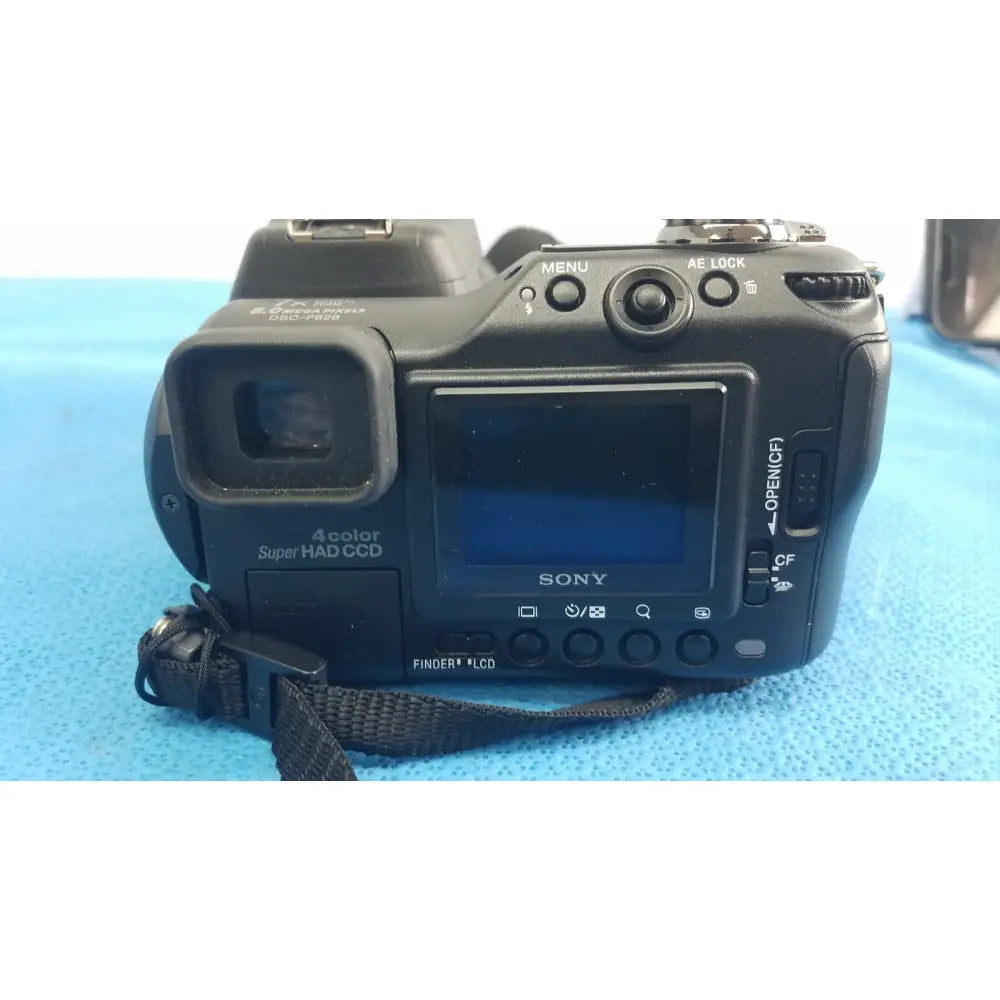 Black sony cyber-shot dsc-f828 digital still camera with 4-color super had ccd sensor and lcd screen shown from back side