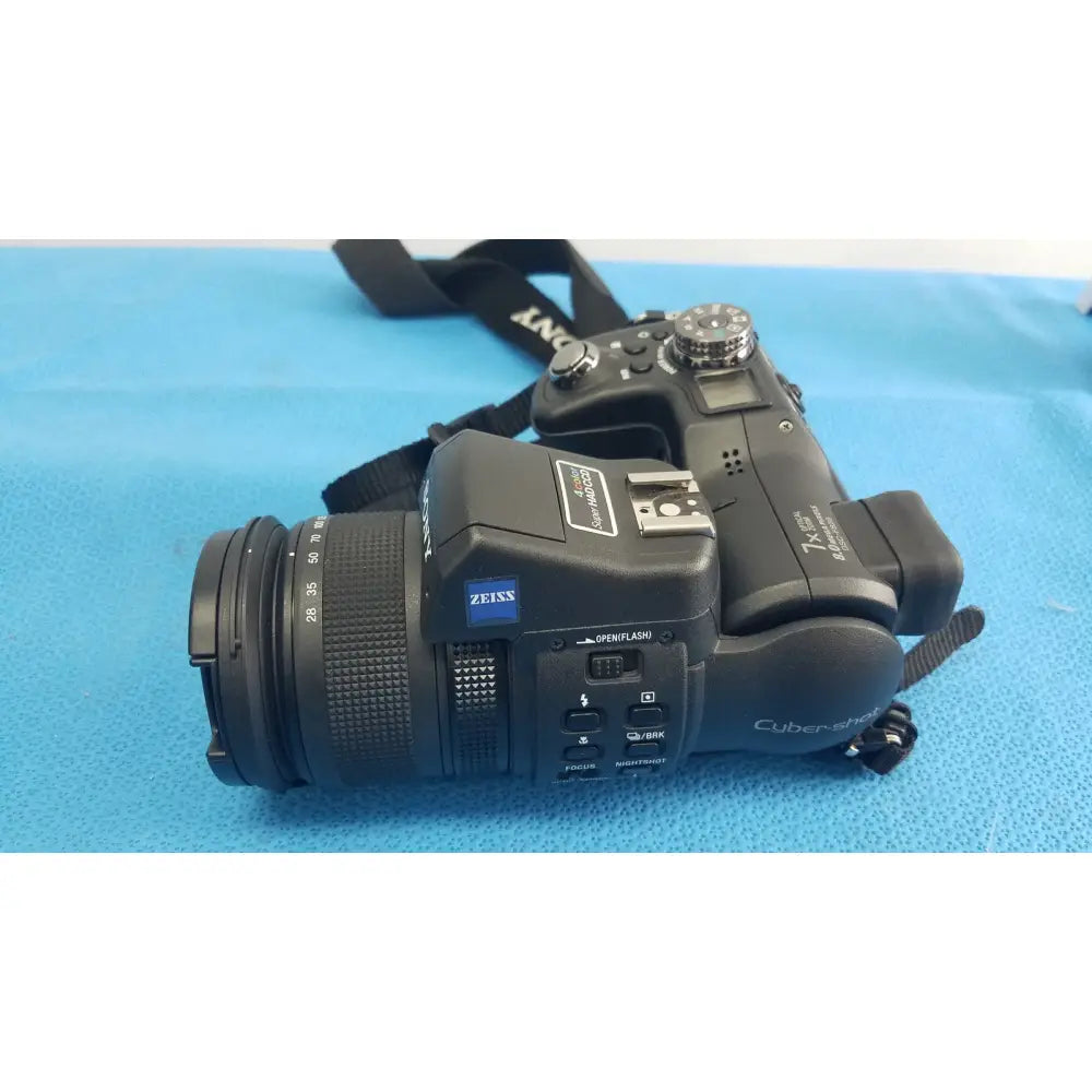 Black sony cyber-shot dsc-f828 digital still camera with zeiss lens and textured grip with included ac power adapter