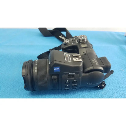 Black sony cyber-shot dsc-f828 digital still camera with zeiss lens and textured grip with included ac power adapter