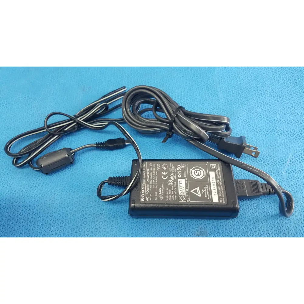 Black sony cyber-shot dsc-f828 ac power adapter with coiled cables and standard plug for cyber-shot dsc-f828 digital camera