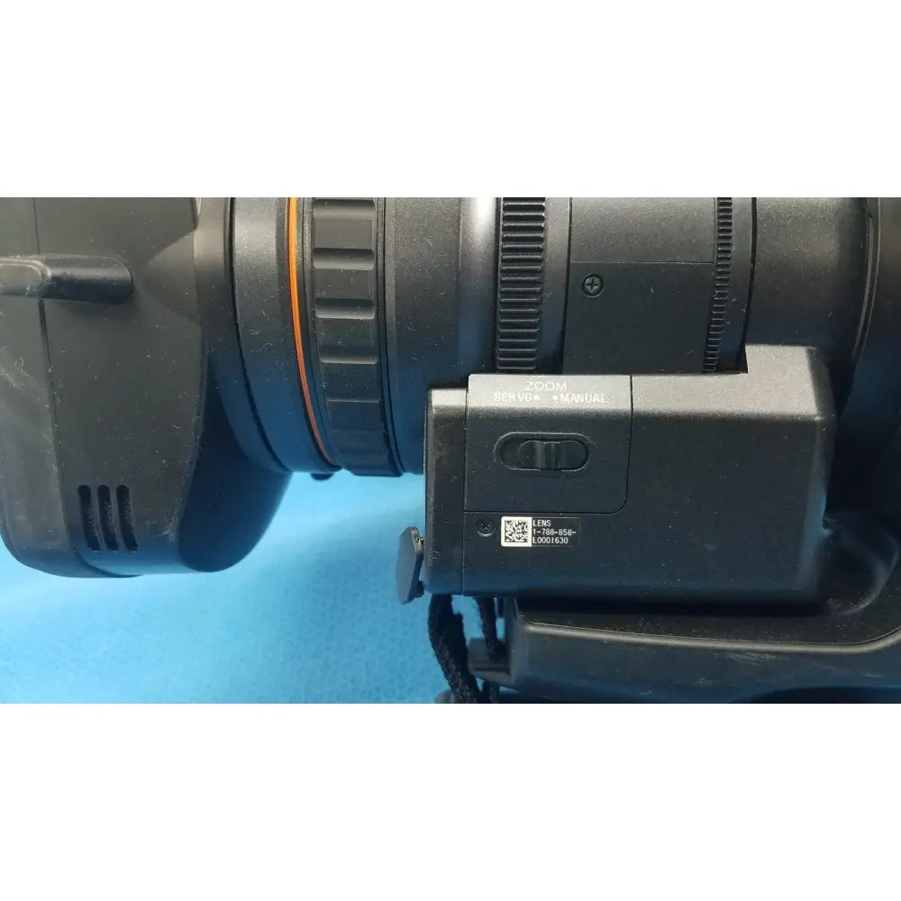 Black camera lens with zoom servo manual switch and qr code label on sony pmw 300 memory xdcam camcorder