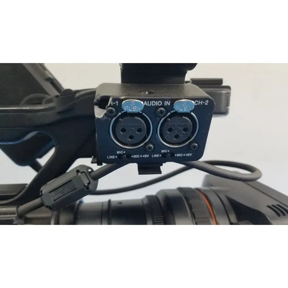 Black audio input module with two xlr connectors and blue push buttons on the back of sony pmw-300 memory xdcam camcorder