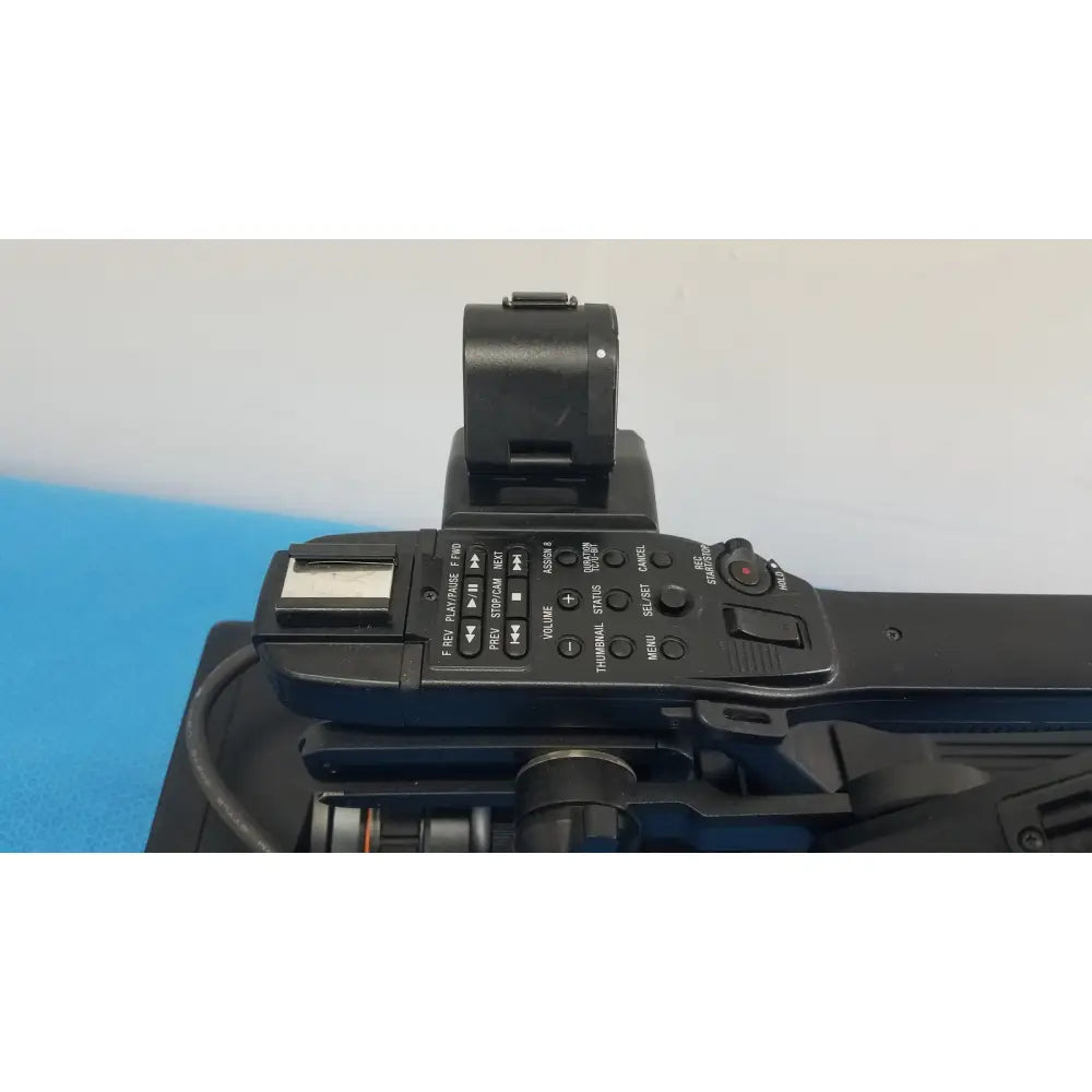 Black canon camera with built-in flash and multiple control buttons for sony pmw-300 memory xdcam camcorder use