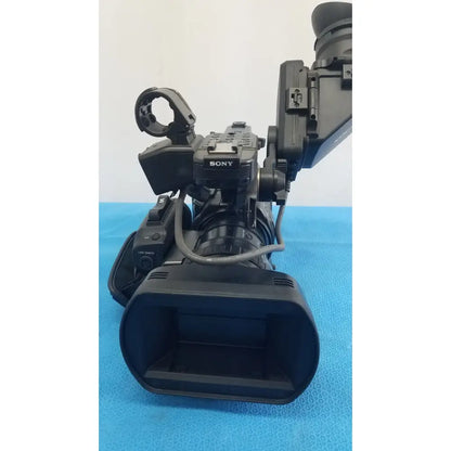 Black sony pmw-300 solid-state memory xdcam camcorder with large lens and attached viewfinder for professional use