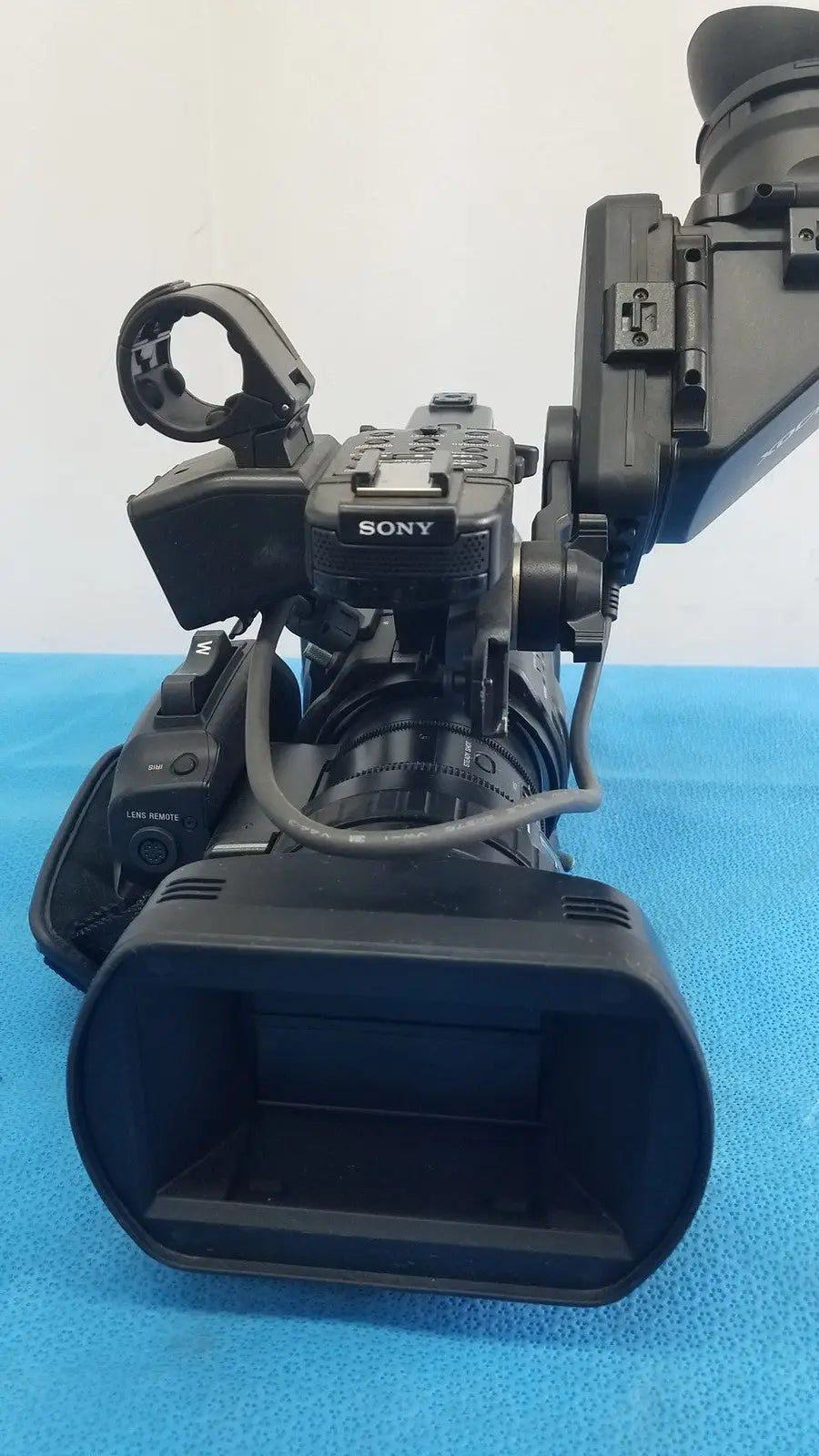 Black sony pmw-300 solid-state memory xdcam camcorder with large lens and attached viewfinder for professional use