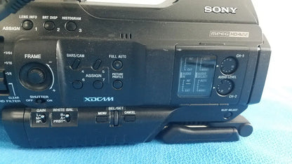 Black sony pmw-300 memory xdcam camcorder with matte finish, control dials, buttons, and small lcd screen
