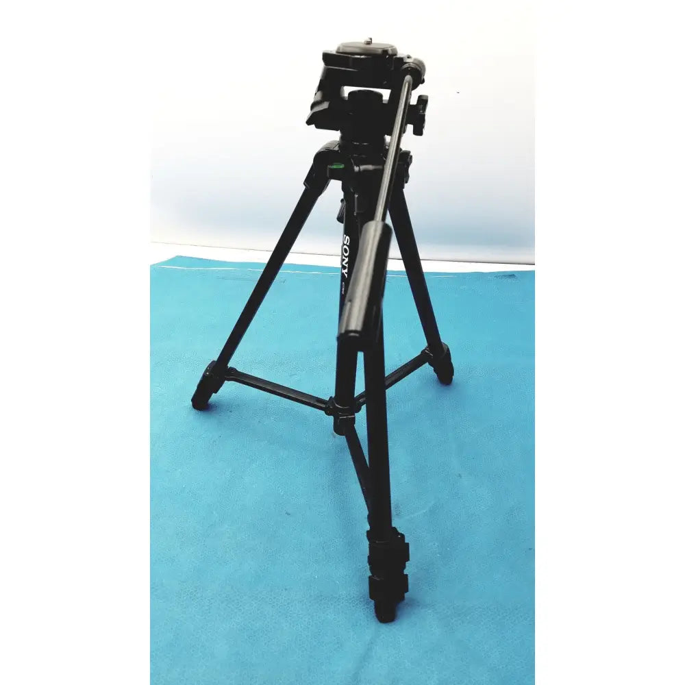 Black sony lightweight extendable video tripod with three extendable legs and camera mounting head for stable shooting