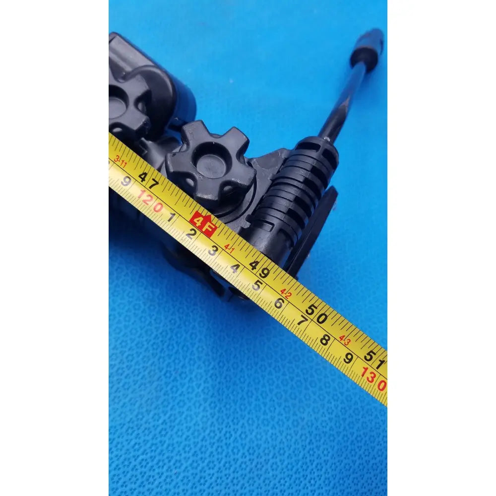 Black plastic gear assembly with textured ribbed sections and cylindrical rod on sony vct-r640 lightweight extendable video tripod