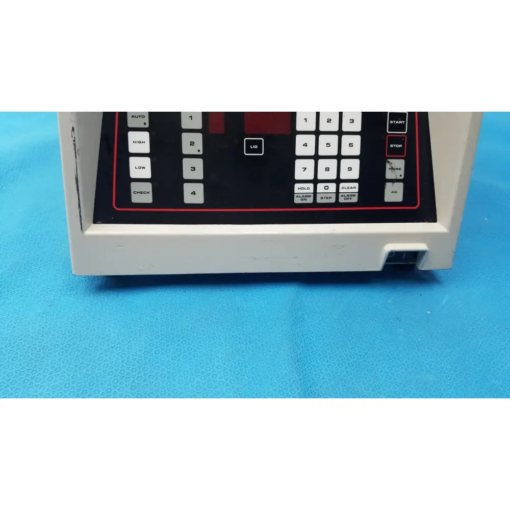 White plastic sorvall cell washer control panel with black keypad and red accent buttons for centrifuge cell washing system