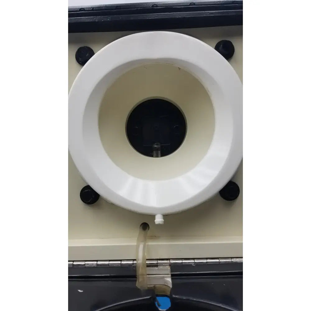 White circular plastic component with black mounting screws and central opening for sorvall cell washer centrifuge cell washing system