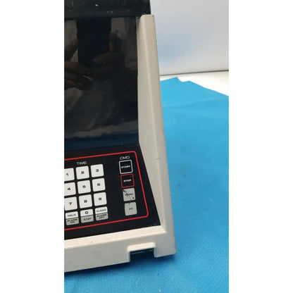 White plastic digital timer with black keypad and red accents for sorvall cell washer centrifuge cell washing system