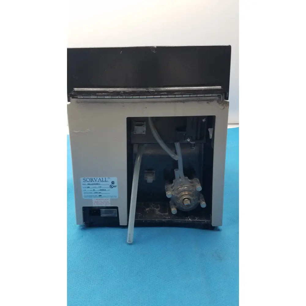 Sorvall cell washer centrifuge with beige exterior and metallic rotor assembly for centrifuge cell washing at 3600 rpm