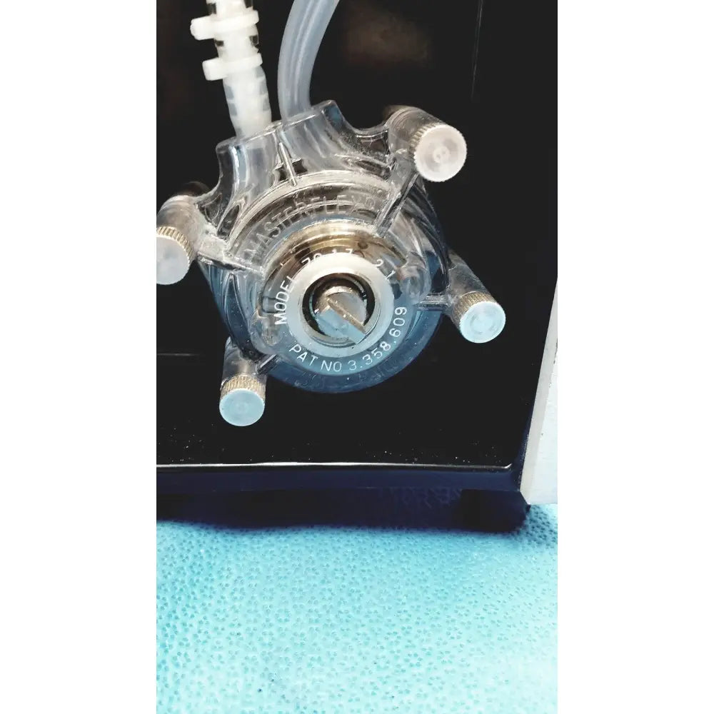 Clear plastic peristaltic pump with metallic fittings and white tubing for sorvall instruments cell washer 2 8603815