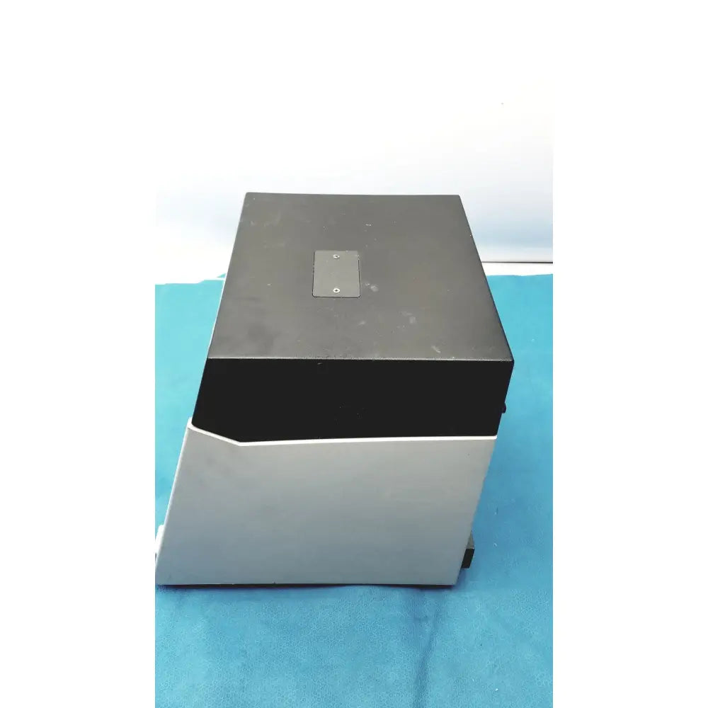 Black and silver sorvall instruments cell washer 2 with matte finish and small metallic plate on top