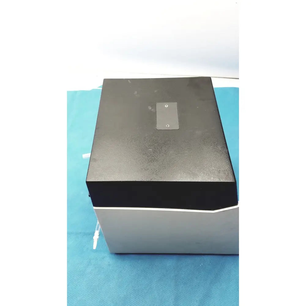 Black and silver sorvall instruments cell washer with matte finish top panel featuring two circular indentations